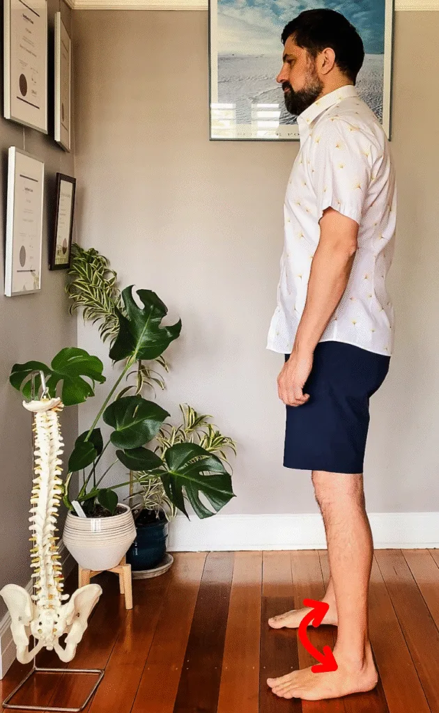 Osteopath for back pain Warrnambool demo: starting hip hinge stance, feet hip-width, neutral spine in clinic.