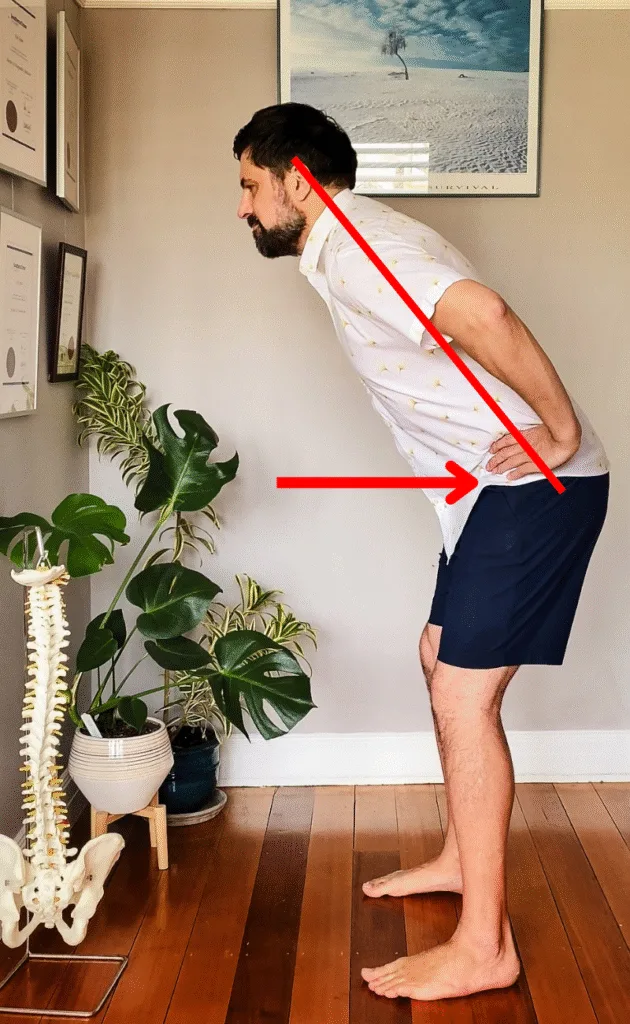 Osteopath for back pain Warrnambool demo: glute squeeze returning from hip hinge to standing, emphasising safe lift mechanics.