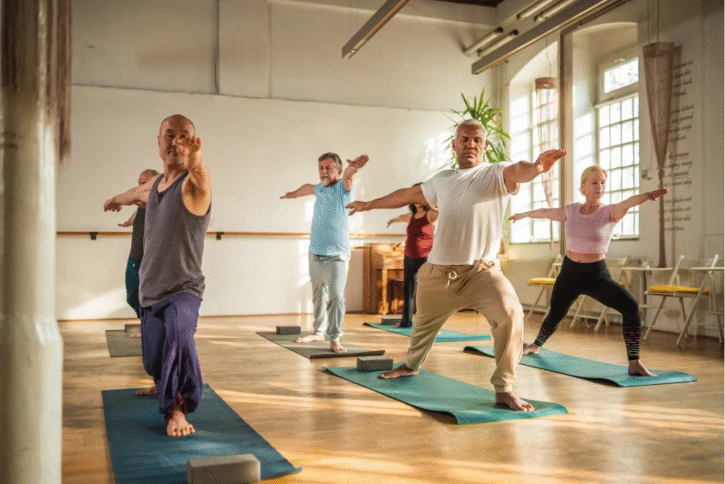 Osteopath for back pain Warrnambool insight: group class practicing yoga poses to build core strength and support healthy lower backs.