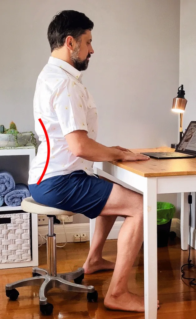 Osteopath for back pain Warrnambool tip: seated pelvic tilt, pelvis back to flatten lumbar curve, relieving desk-related stiffness.