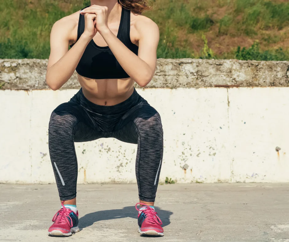 Deep squat exercise for hip mobility in active woman, focus of osteopathic care at The Barefoot Osteo Warrnambool