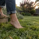 Bare feet stepping onto grass in Warrnambool during spring